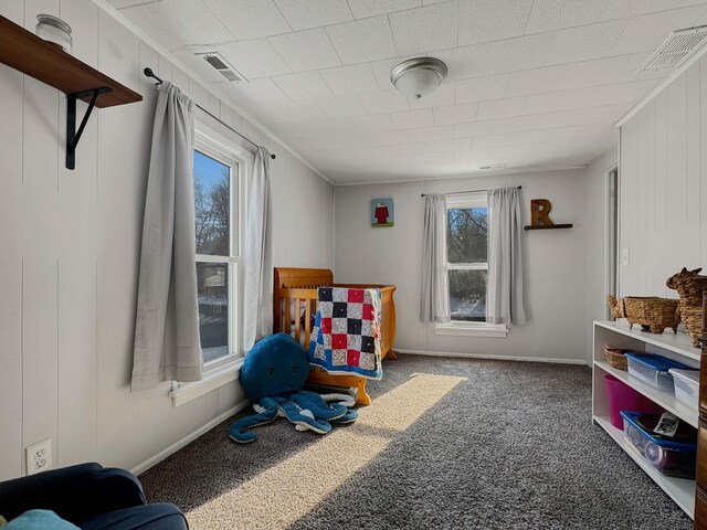 playroom featuring carpet floors, visible vents, and baseboards