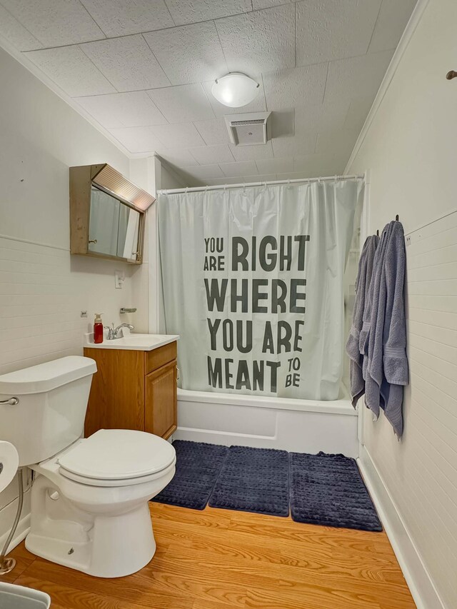 full bathroom with toilet, shower / bath combo, ornamental molding, and vanity