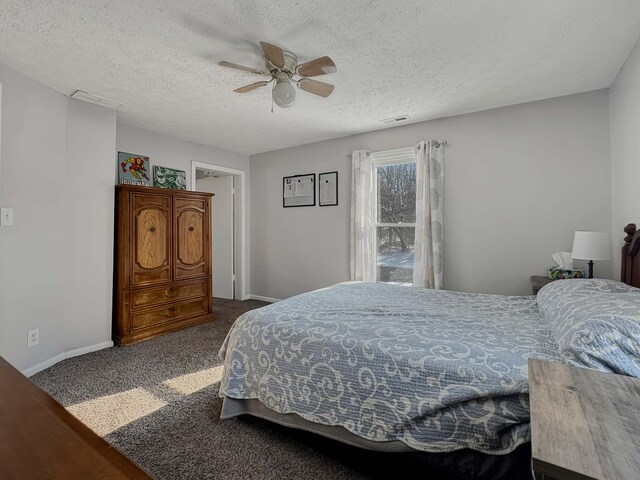 carpeted bedroom with visible vents, ceiling fan, a textured ceiling, and baseboards