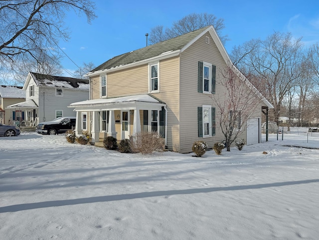 view of front of house featuring a garage and a porch