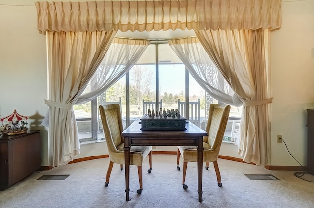 dining space featuring visible vents, baseboards, and carpet flooring