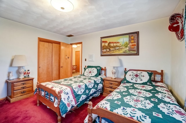 carpeted bedroom with a closet