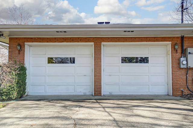 garage featuring driveway