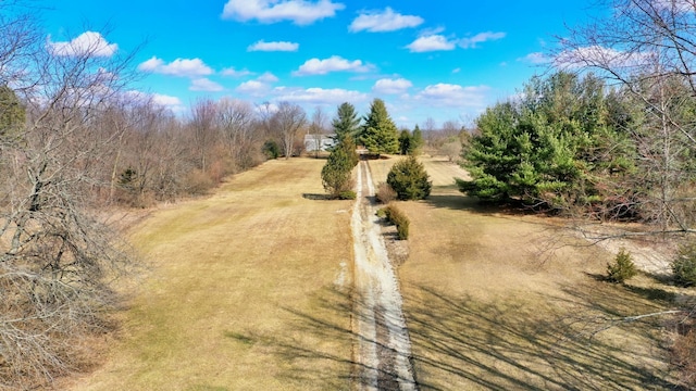 birds eye view of property with a rural view