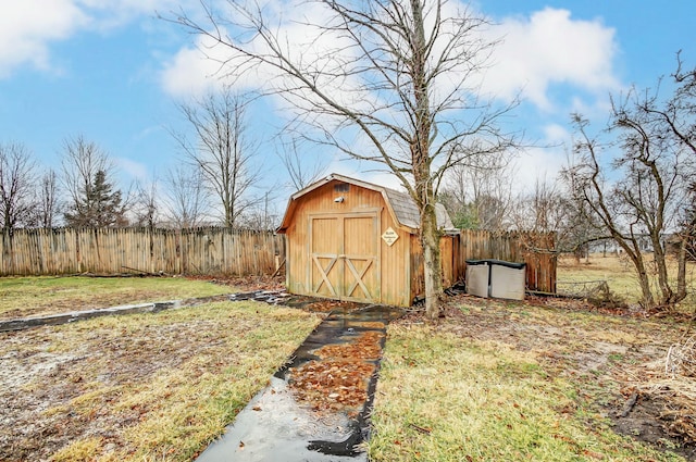 view of shed featuring fence