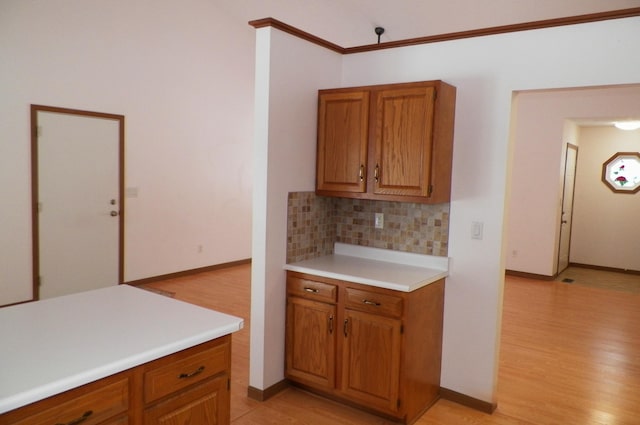 kitchen with decorative backsplash and light wood-type flooring