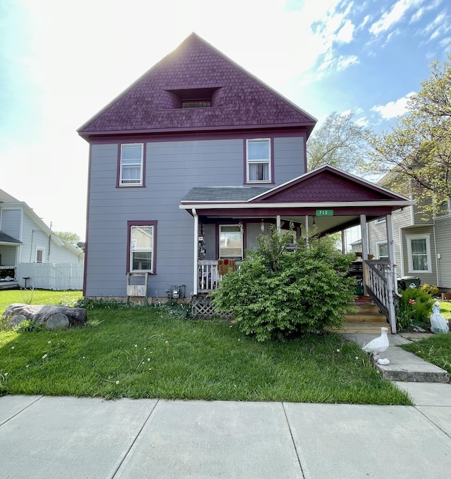712 S Clay St, Troy, OH 45373 - view of property with a porch and a front yard