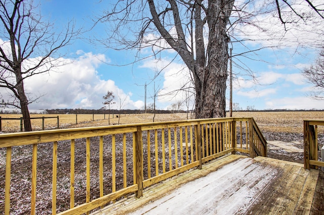 wooden deck featuring a rural view