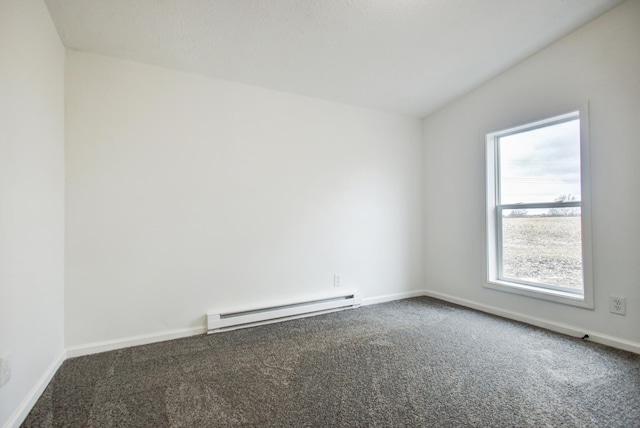 carpeted spare room with a baseboard heating unit and baseboards