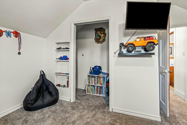 playroom featuring carpet flooring, baseboards, and lofted ceiling