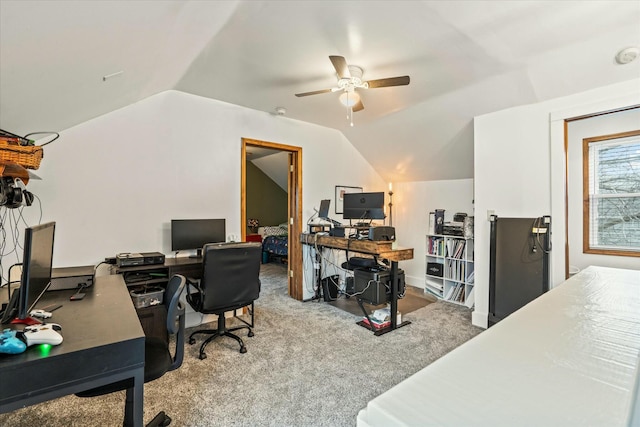 home office featuring ceiling fan, carpet, and lofted ceiling