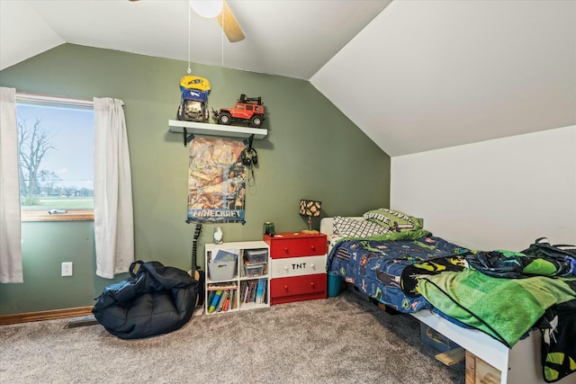 bedroom featuring ceiling fan, lofted ceiling, and carpet floors