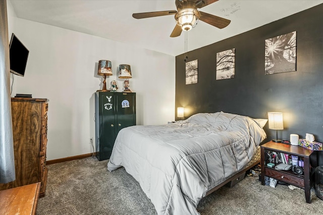 carpeted bedroom with baseboards and ceiling fan