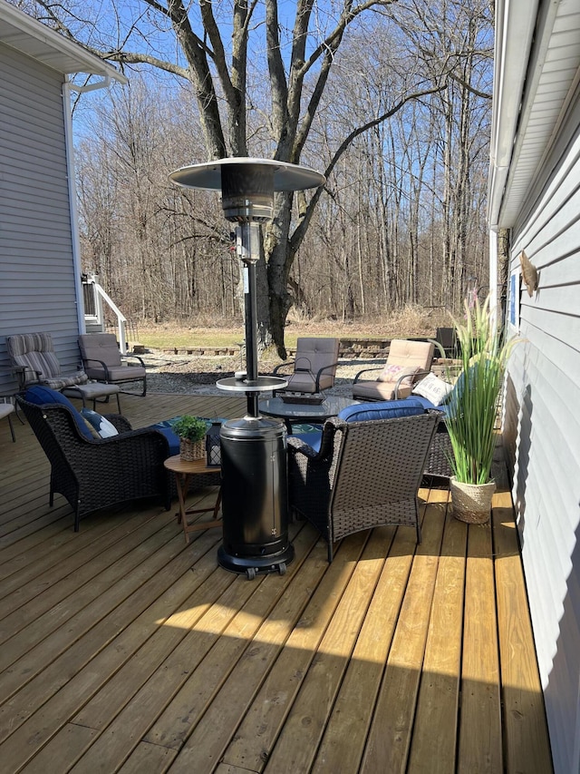 wooden deck with an outdoor living space