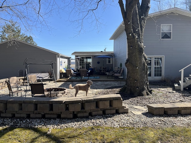 exterior space with an outdoor fire pit, a patio area, and entry steps