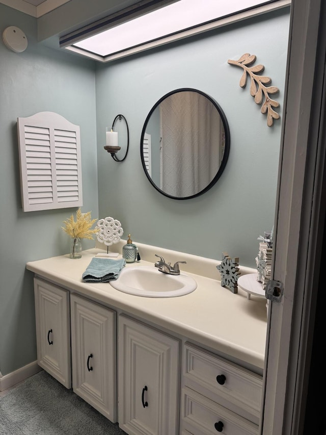 bathroom featuring vanity and baseboards