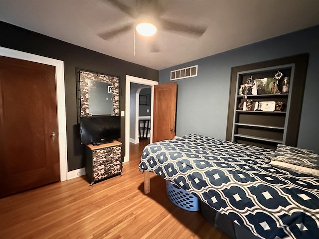 bedroom featuring hardwood / wood-style floors and ceiling fan