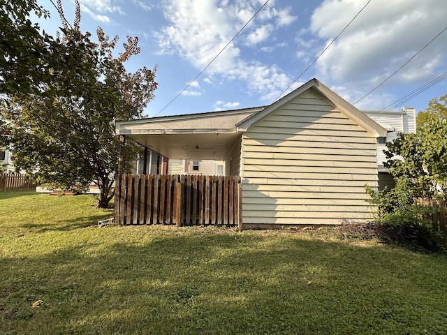 view of home's exterior with a lawn