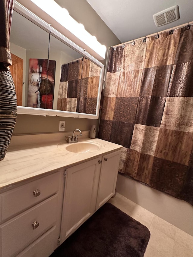 bathroom with vanity and shower / tub combo with curtain