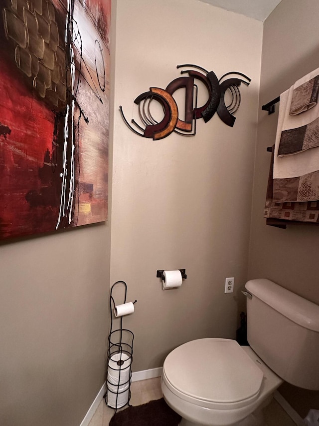 bathroom featuring tile patterned floors and toilet