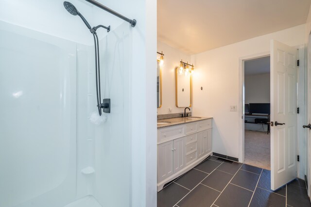 4100 Joshane St, Springfield, OH 45502 - bathroom with walk in shower, a sink, and tile patterned floors