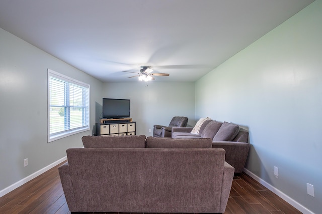 4100 Joshane St, Springfield, OH 45502 - living room with baseboards, a ceiling fan, and dark wood-type flooring