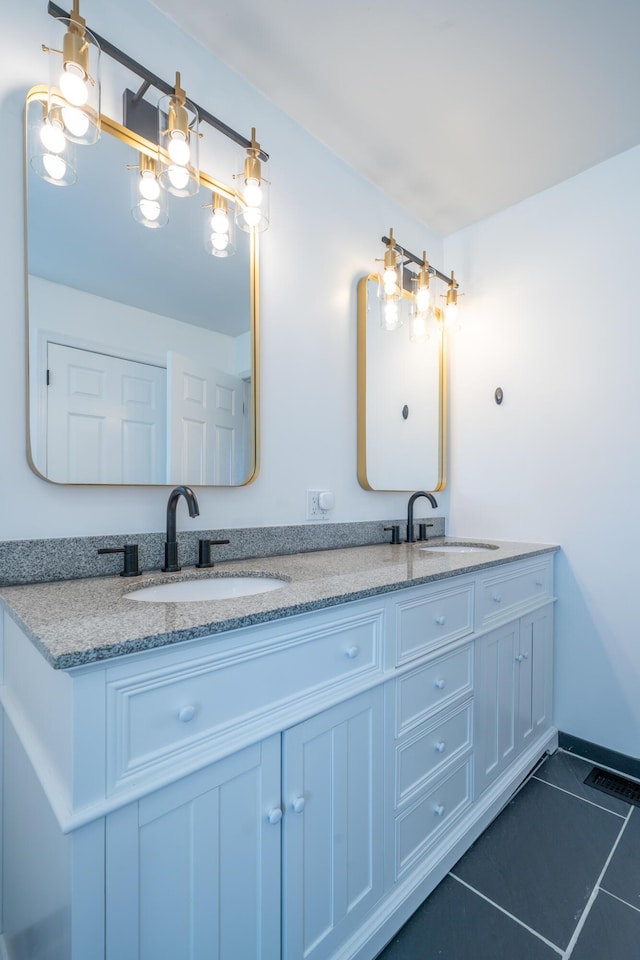 4100 Joshane St, Springfield, OH 45502 - bathroom with tile patterned floors, a sink, double vanity, and visible vents