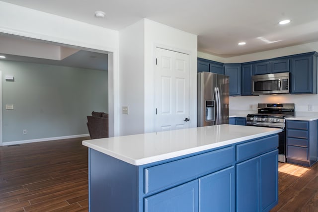 4100 Joshane St, Springfield, OH 45502 - kitchen featuring blue cabinets, light countertops, appliances with stainless steel finishes, and dark wood finished floors