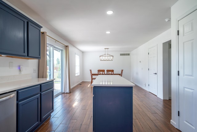 4100 Joshane St, Springfield, OH 45502 - kitchen with dark wood finished floors, dishwasher, visible vents, blue cabinets, and a center island