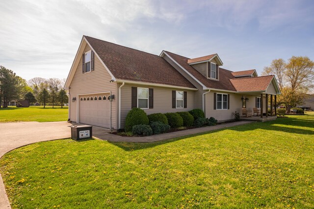 4100 Joshane St, Springfield, OH 45502 - view of property exterior featuring driveway, a yard, a shingled roof, and a garage