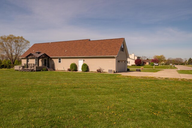 4100 Joshane St, Springfield, OH 45502 - view of property exterior with driveway, a wooden deck, an attached garage, a shingled roof, and a lawn