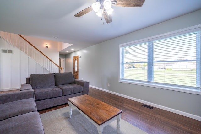 4100 Joshane St, Springfield, OH 45502 - living room with wood finished floors, visible vents, baseboards, stairs, and ceiling fan