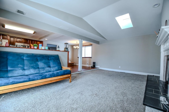 living area with a fireplace, dark colored carpet, an inviting chandelier, lofted ceiling with skylight, and baseboards