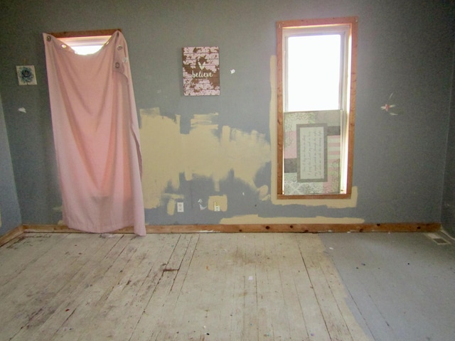 empty room featuring wood-type flooring