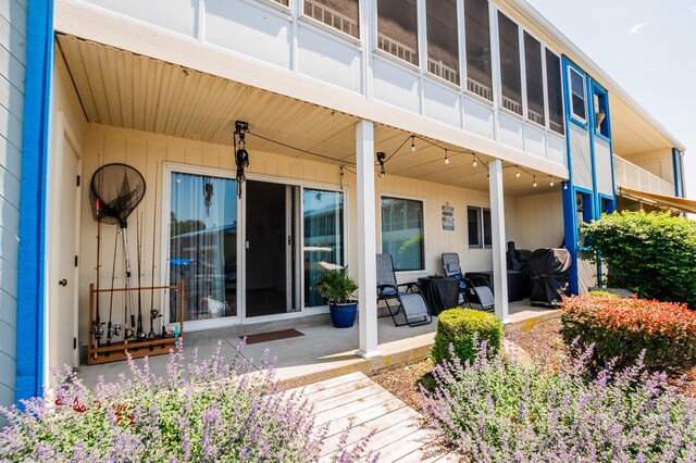 property entrance featuring a patio