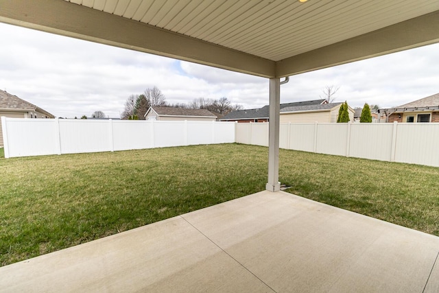 view of yard with a fenced backyard and a patio