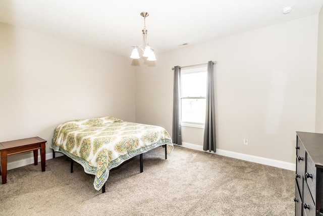 bedroom with light carpet, baseboards, a notable chandelier, and visible vents