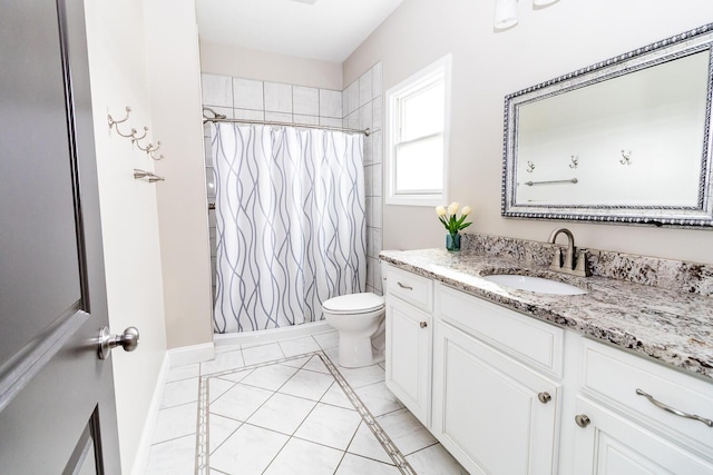 full bathroom with tile patterned floors, toilet, vanity, a shower with curtain, and baseboards