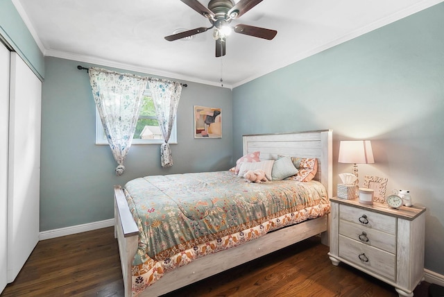 1306 Kercher St, Miamisburg, OH 45342 - bedroom featuring dark wood finished floors, crown molding, baseboards, a closet, and ceiling fan