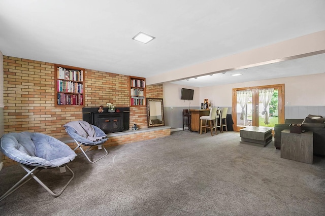 1306 Kercher St, Miamisburg, OH 45342 - living area featuring carpet floors, a fireplace, and brick wall