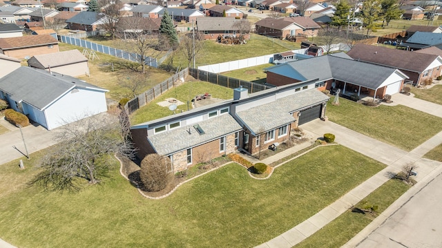 birds eye view of property with a residential view