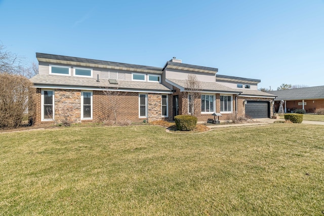 view of front of home featuring brick siding, a garage, driveway, and a front lawn