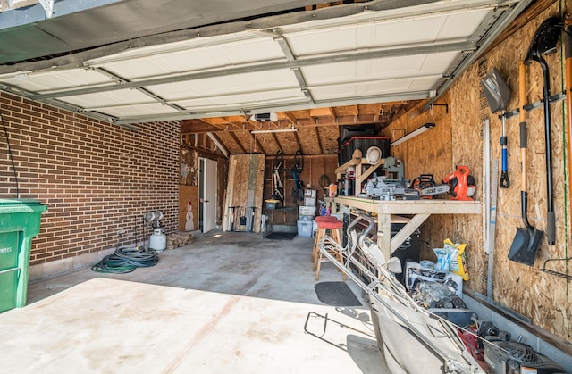 garage featuring a workshop area and a garage door opener