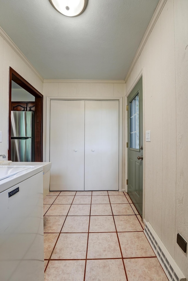 5341 Riffle Rd, Ansonia, OH 45303 - laundry area featuring ornamental molding, light tile patterned flooring, and washer / clothes dryer