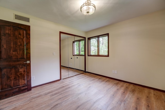 5341 Riffle Rd, Ansonia, OH 45303 - unfurnished bedroom with wood finished floors, baseboards, and a closet