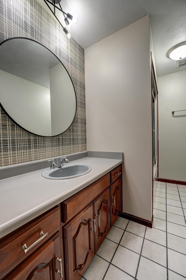 5341 Riffle Rd, Ansonia, OH 45303 - full bath featuring vanity, tile patterned floors, a shower with shower door, and baseboards