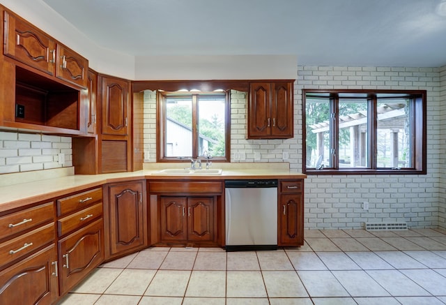 5341 Riffle Rd, Ansonia, OH 45303 - kitchen featuring stainless steel dishwasher, a sink, light tile patterned flooring, and light countertops