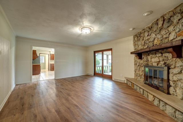 5341 Riffle Rd, Ansonia, OH 45303 - unfurnished living room featuring crown molding, wood finished floors, a fireplace, and baseboards