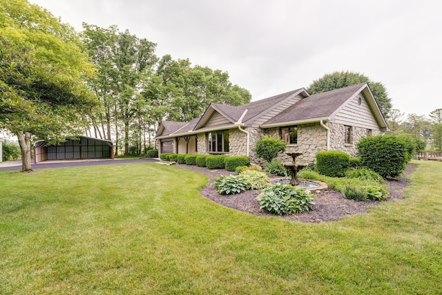 5341 Riffle Rd, Ansonia, OH 45303 - view of side of home featuring stone siding, an attached garage, a lawn, and driveway