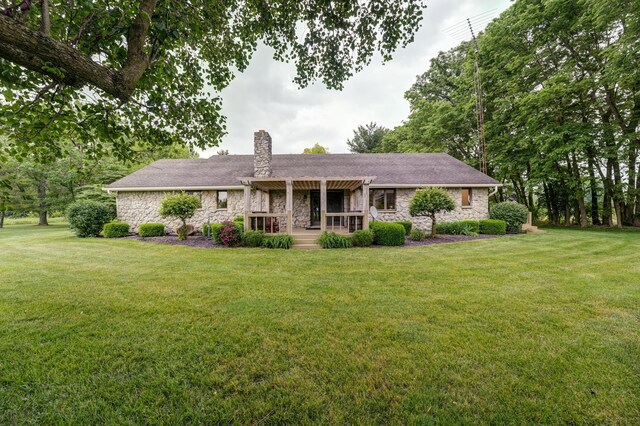 5341 Riffle Rd, Ansonia, OH 45303 - ranch-style house featuring stone siding, a chimney, and a front lawn